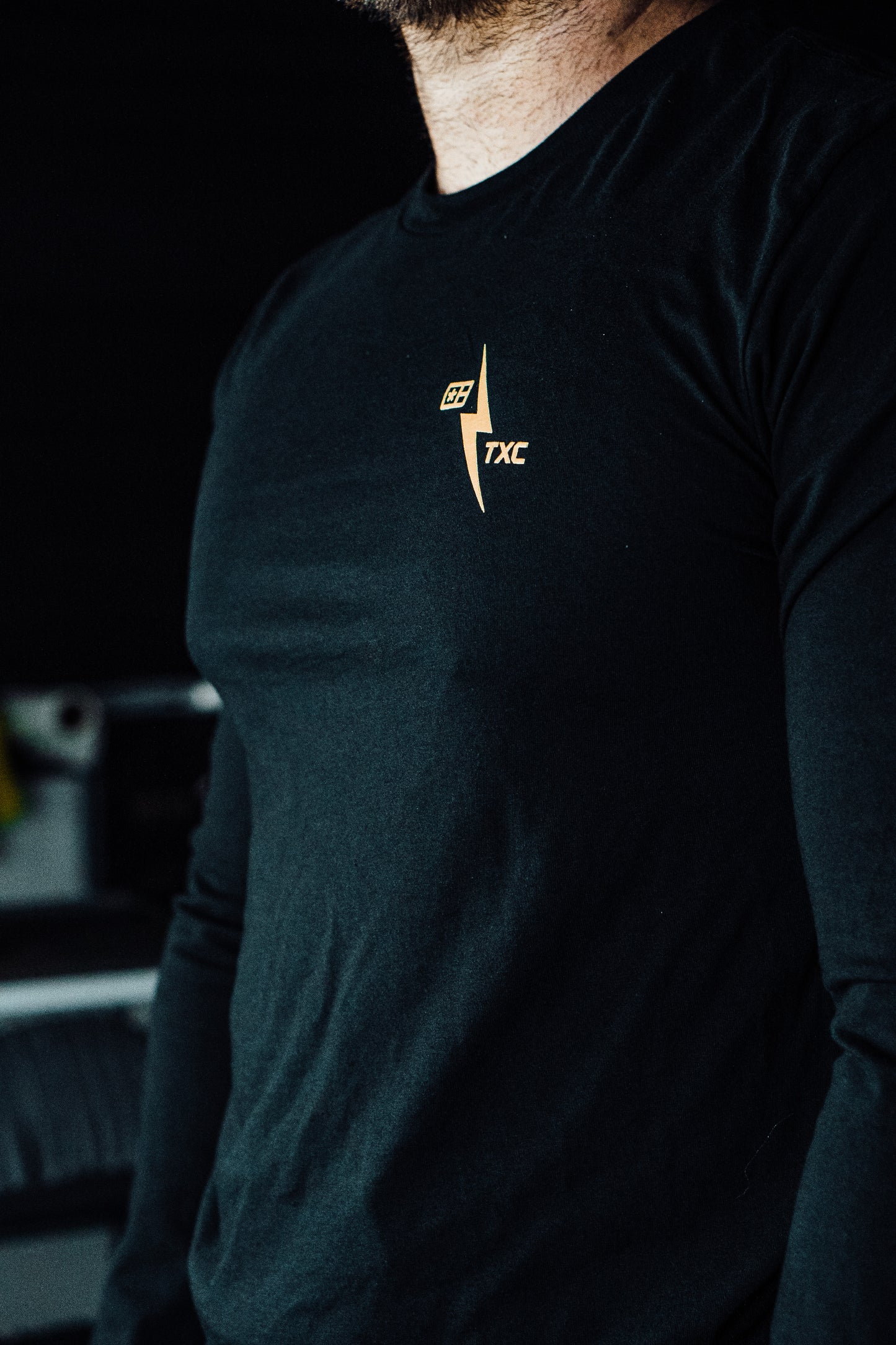 
                  
                    Black Long-sleeve shirt with Tan logo
                  
                